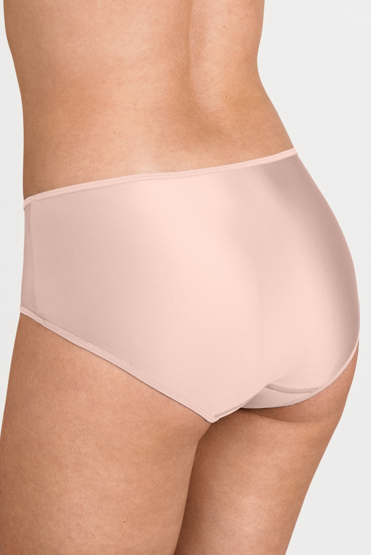 Back view of a model wearing smooth light pink Miss Mary maxi panty in soft micro-feel fabric.