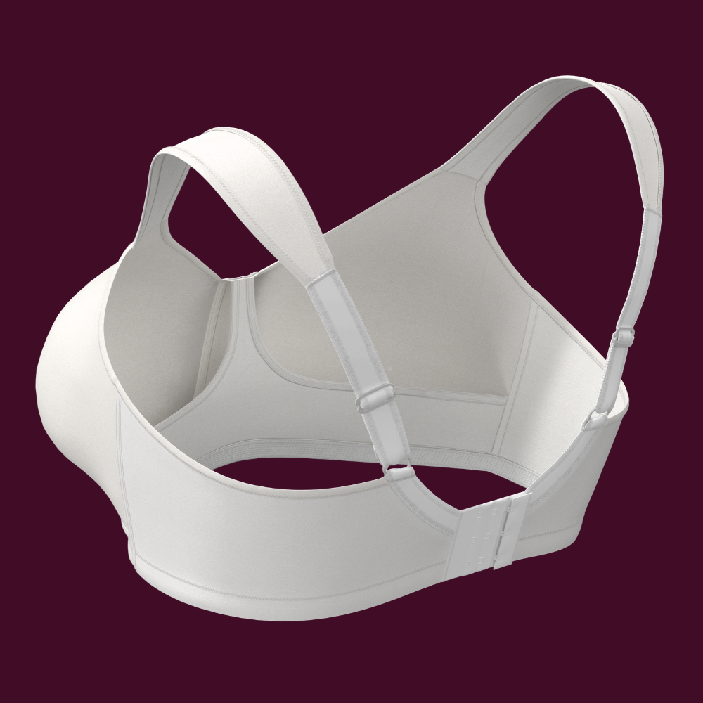 White bra with adjustable straps and back closure, displayed on a maroon background.