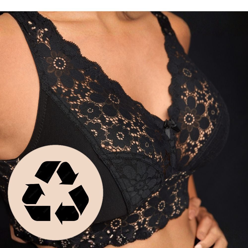 Close-up of a black lace bra with floral patterns, featuring a recycling symbol overlay in the corner.