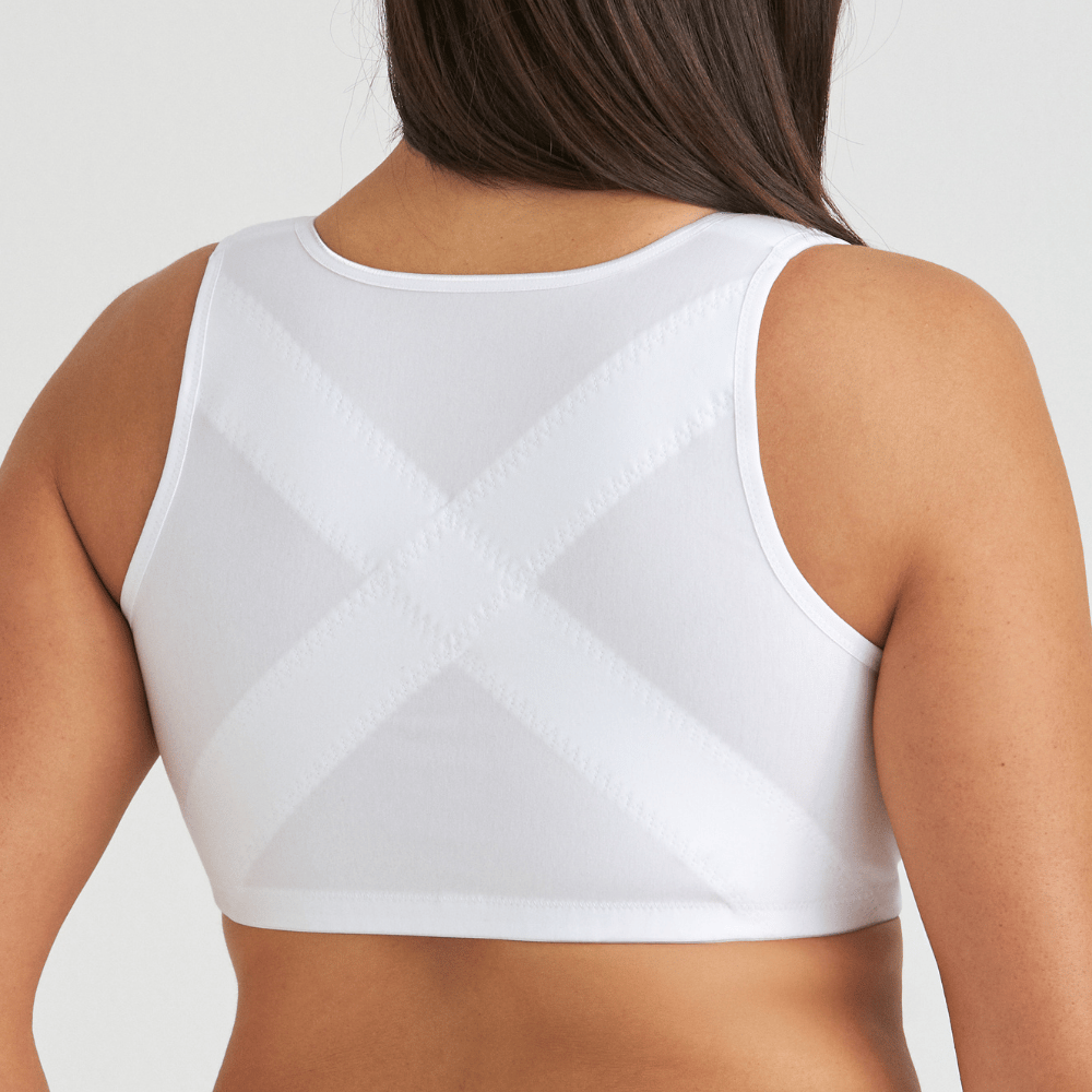A person wearing a white posture support garment, showing a crisscross design on the back.