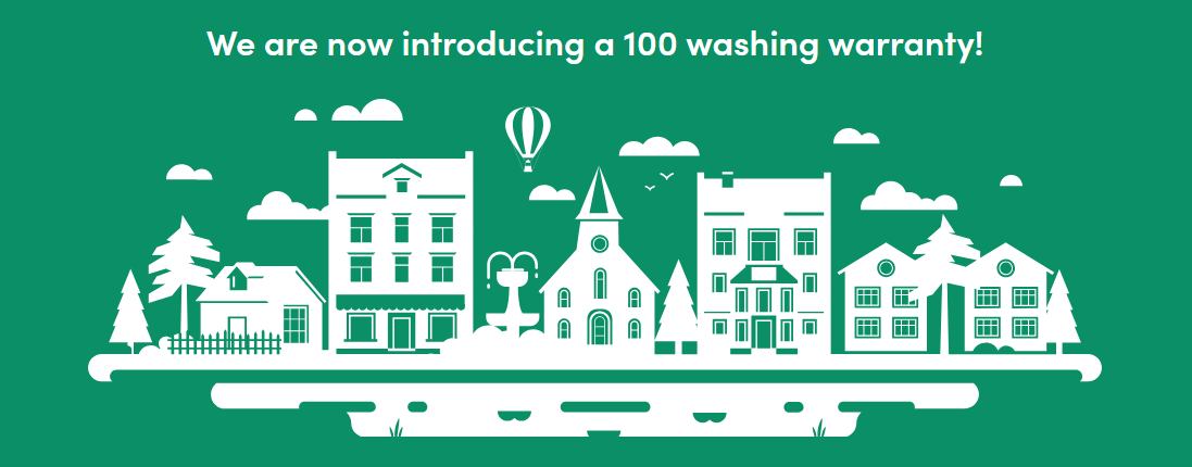 Illustration of a quaint town with trees, houses, and a church on a green background with text: "We are now introducing a 100 washing warranty!"